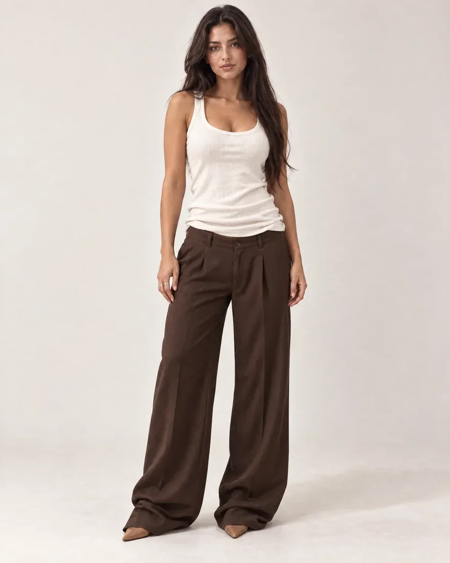 the same ivory tank and espresso trousers, untucked