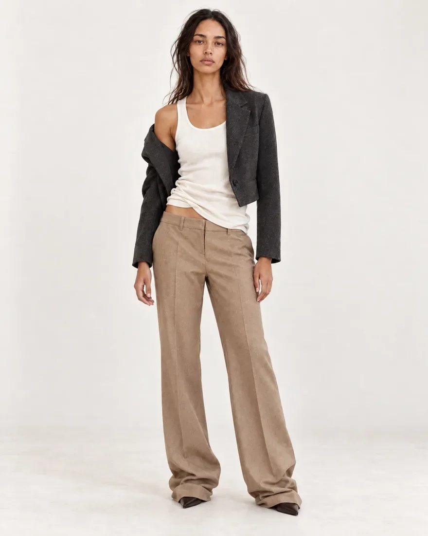 charcoal blazer and tan trousers, unstyled